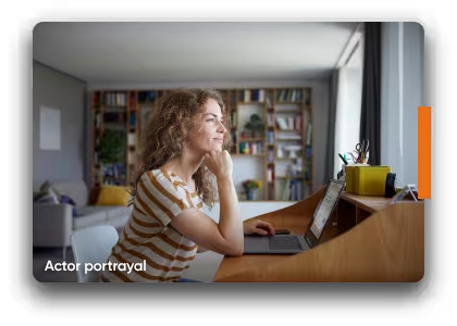 A woman seated at a desk with a laptop, illustrating a proactive approach to looking for more info about MAVENCLAD® (cladribine). Not a real patient.